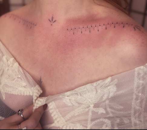 Delicate collarbone floral fine-line tattoo