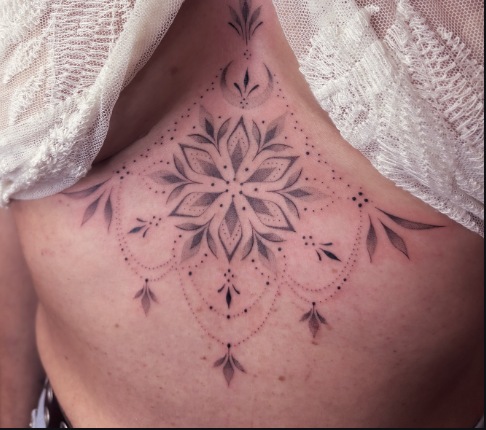 Fine-line ornamental sternum mandala in black ink by Bibi Lea